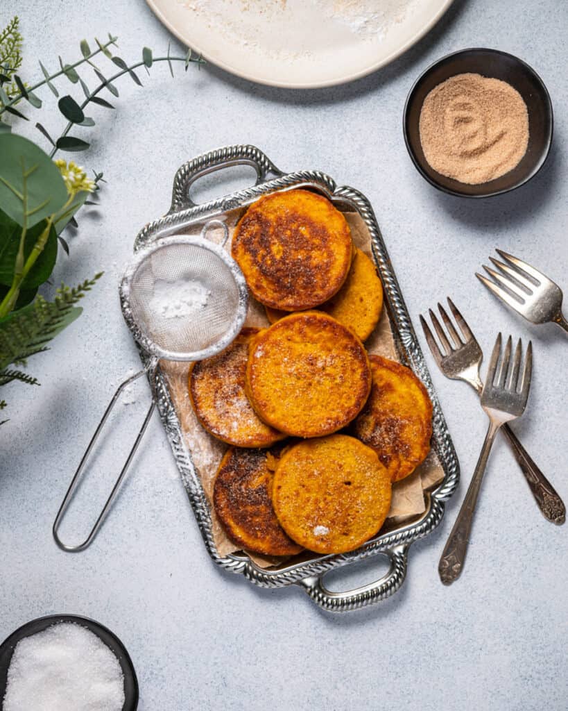 Mini pancakes made from pumpkin topped with brown sugar